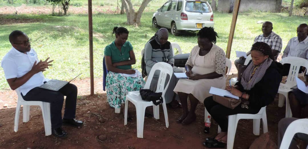 Community Based service Department top management pause for a photo after briefing the vice chairperson about the department Community Staff